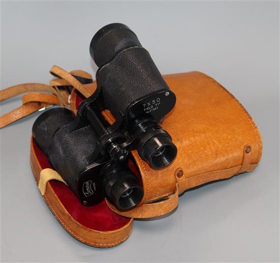 A pair of luminus 7 x 50 binoculars in leather case